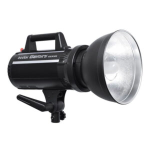 The Godox GS300II is a black studio strobe light with silver reflector, top handle and lower mounting bracket, designed for professional photography.