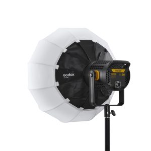 The Godox CS50D Lantern Softbox 50cm studio light is mounted on a stand and features a large round white softbox with black accents and a yellow-black control panel on the back.