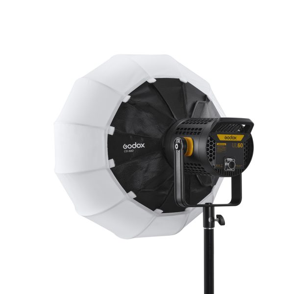 The Godox CS50D Lantern Softbox 50cm studio light is mounted on a stand and features a large round white softbox with black accents and a yellow-black control panel on the back.