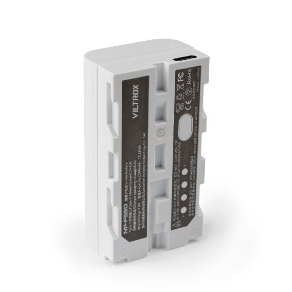 The white Viltrox NP-F550 USB-C rechargeable battery pack stands upright, with a label with specifications, certification icons and a USB-C charging port at the top.