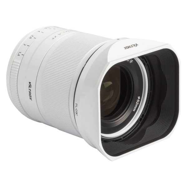 Limited edition white Viltrox AF 33mm f/1.4 lens for the Fuji X system with large square backlight hood and focal length markings on the barrel.