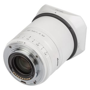 The Viltrox AF 56mm f/1.4 lens, Fuji X (Limited Edition White) is visible from the rear, with its white finish, metal mount with electronic contacts and aperture markings on the barrel.