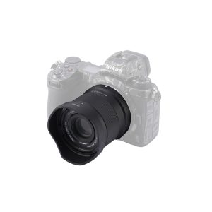 The Viltrox AF 40mm f/2.5 lens with backlight protection is mounted on the semi-transparent Nikon Z7 camera body, isolated on a white background.