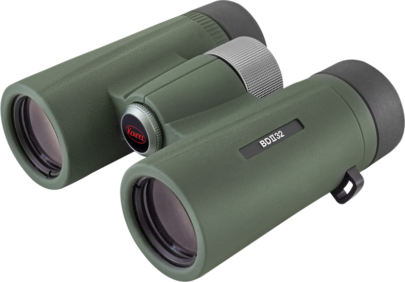 The green KOWA BDII-XD 6,5X32 WA binoculars with textured handles, central focus knob and visible eyepieces and objectives are shown as viewed from an angle.