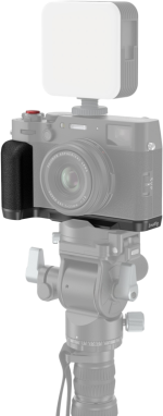 With the Fujifilm X100VI and SmallRig 4556B L-shaped grip (black) attached to the end of the tripod, the camera and accessories are in sharp focus, while the base of the tripod appears slightly faded - ideal for photographic or video shooting setups.