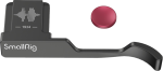 Black metal SmallRig 4559 mirror grip for Fujifilm X100VI/X100V with curved handle, sound altography, "1934" marking and separate round red button.