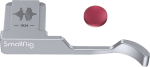 The SmallRig 4566 Thumb Grip for Fujifilm X100VI/X100V (silver) features a curved grip with "1934" engraved on it and a sound wave placed next to a round red button.