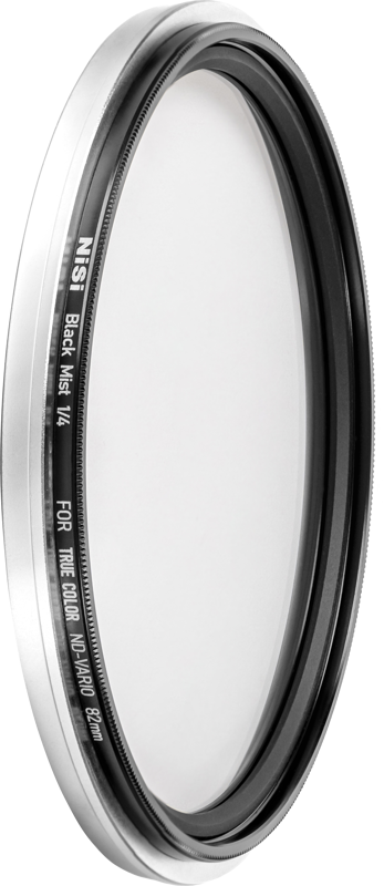 Close-up of a circular camera lens filter marked NiSi Filter Swift System Black Mist 1/4 67mm diffusion filter with a thin black and silver metal frame.