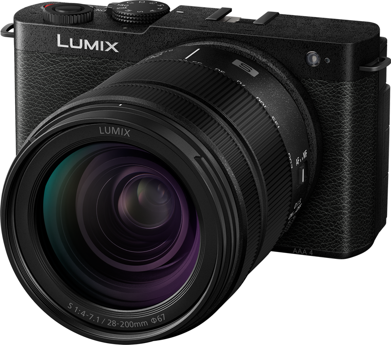 The Panasonic Lumix S9 Jet Black, with a 28-200mm f/4-7.1 Macro lens, is shot from the front and side of the camera body, showing off its large zoom lens.