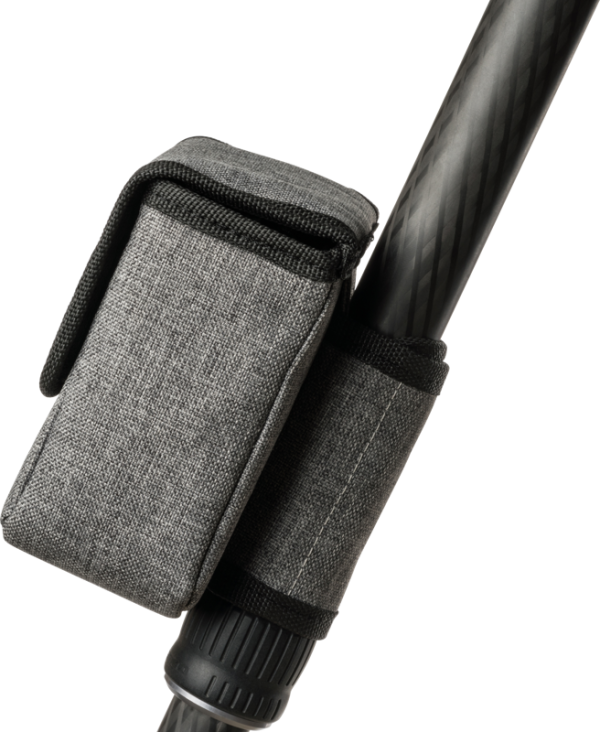 NiSi Pouch for M75 Holder and Filters, grey fabric with flap, is attached to a black patterned pole with a matching grey strap with black edges.