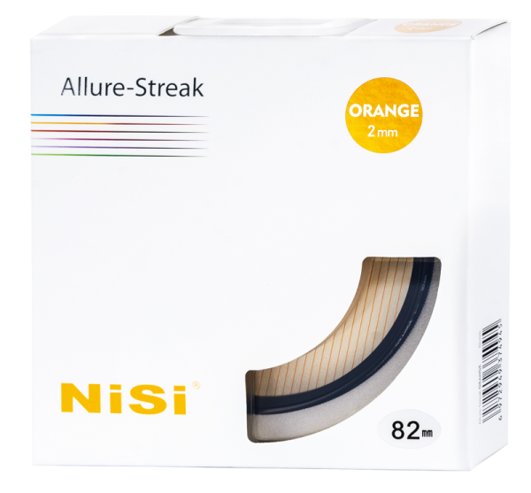 The white box, which reads "Nisi Filter Allure Streak Orange 2mm 82mm", shows the orange camera filter through a clear window in the bottom right corner. The box is decorated with coloured lines and text.