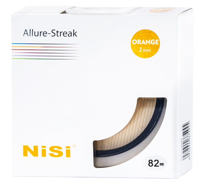 The white box, which reads "Nisi Filter Allure Streak Orange 2mm 82mm", shows the orange camera filter through a clear window in the bottom right corner. The box is decorated with coloured lines and text.