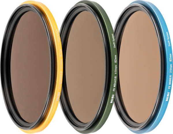 The three NiSi Filter Swift System FS ND Kit (8+64+1000) 40.5-49 mm filters with coloured rims stand upright in a row on a white background, each rim bearing the NiSi logo and specifications.