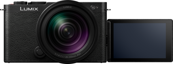The Panasonic Lumix S9 Jet Black with 28-200mm f/4-7.1 Macro lens is seen from the front. Its LCD screen is turned to the right, off, and shows a blank, dark surface.