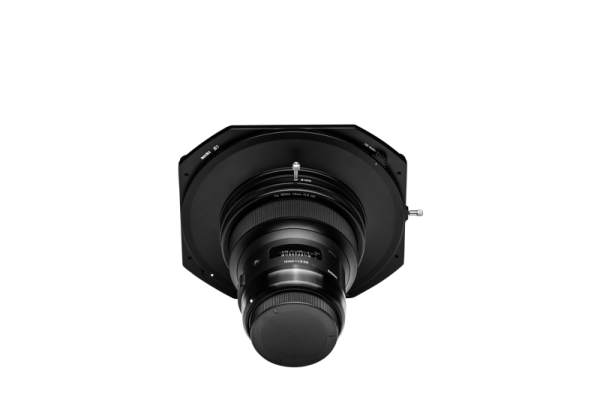 The NiSi Filter S5 Adapter for Sigma 14mm f/1.8 (adapter only) is shown from the front, mounted on a large, flat, black, octagonal lens plate with a protective cap, against a white background.