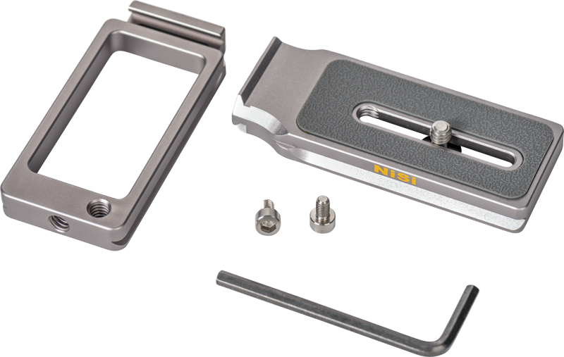 The NiSi Universal Adjustable L-Plate NLP-C kit includes a metal camera mounting plate, two screws, an L-shaped hexagonal wrench and two rectangular metal parts with NiSi marking, all on a white background.