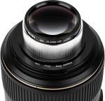 Close-up of a camera lens with a NiSi Close Up Lens Kit NC 49mm close-up lens with detailed grooves and glass elements.