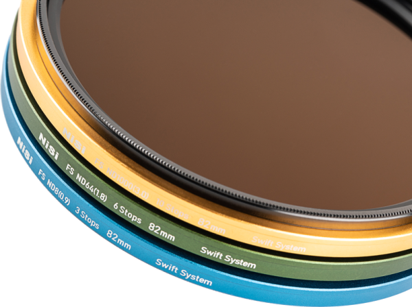 Close-up of three stacked NiSi Filter Swift System FS ND Kit (8+64+1000) 40.5-49mm grey filters, each with filter values and sizes marked on a white background. The text includes NiSi, Swift System and filter stop information.