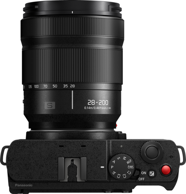 Top view of Panasonic Lumix S9 Jet Black digital camera with 28-200mm f/4-7.1 Macro lens with controls, power switch, shutter button and camera shoe mount.
