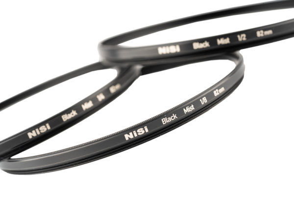 Close-up of NiSi Filter Black Mist 1/2 52mm diffusion filter against a white background.