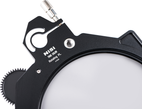 Close-up of the NiSi Cine Filter Rotating CPL TRUE COLOR 4x5.65" disc filter, showing the circular polarizer, metal gear, mounting slot and control knob against a white background.