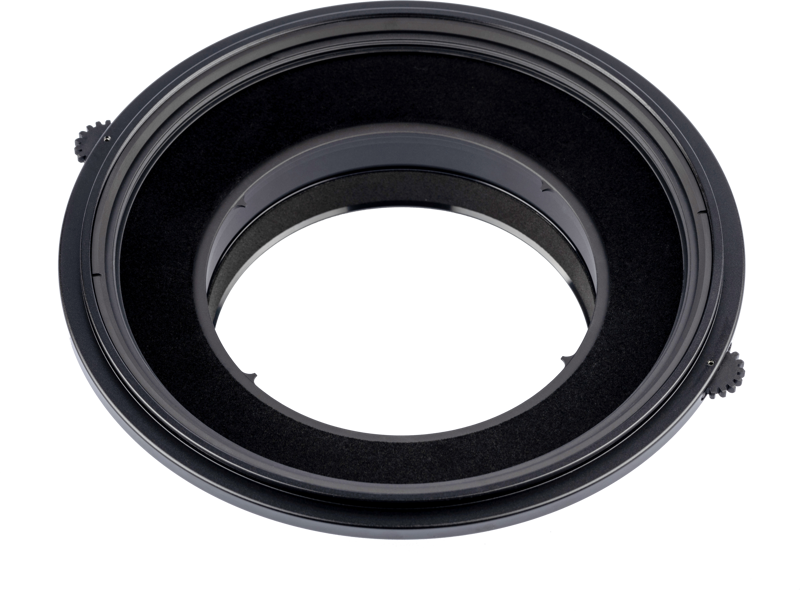 Close-up of the NiSi Filter Holder S6 Kit Landscape for Canon TS-E 17mm f/4, a black, circular adapter with two knobs for attaching the filters to the camera lens, against a white background.
