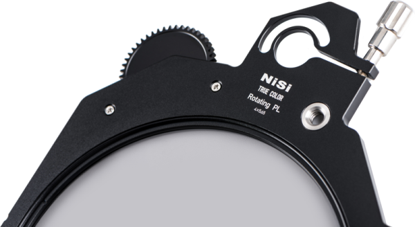 Close-up NiSi Cine Filter Rotating CPL TRUE COLOR 4x5.65" disc filter, highlighting the circular filter, adjustment wheel and metal locking mechanism against a plain background.