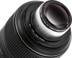 Close Up NiSi Close Up Lens Kit NC 49mm close up lens attached to the camera lens with an adapter ring, highlighting the detailed patterns on the lens and metal parts.