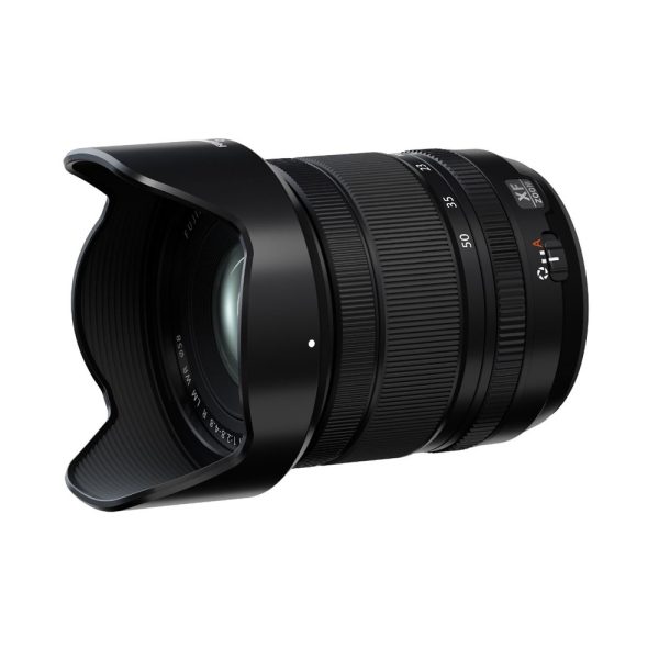Black Fujifilm Fujinon XF 16-50mm f/2.8-4.8 R LM WR zoom lens with lens hood attached, in white background.