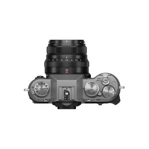 Fujifilm X-T50 system camera, top-down view of the grey metal body with black lens, ISO, shutter speed and exposure compensation dials and hot shoe mount in the centre.