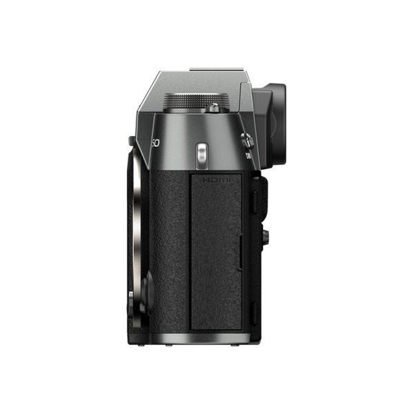 Side view of Fujifilm X-T50 system camera, grey textured grip, lens mount, viewfinder and labelled HDMI port, against a white background.