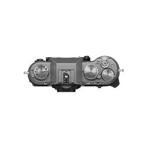 Top view of the Fujifilm X-T50 system camera, silver, showing its silver-coloured dials, buttons and hot shoe mount against a white background.