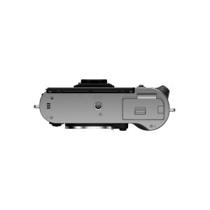Fujifilm X-T50 system camera, silver; compact digital camera with silver body, top down, lens, battery compartment and control dials against a white background.