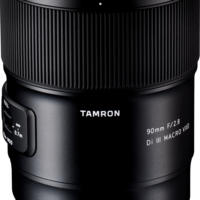 The Tamron 90mm f/2.8 Di III Macro VXD lens for the Sony E is shown upright on a white background, with the brand name and specifications clearly visible on the barrel.