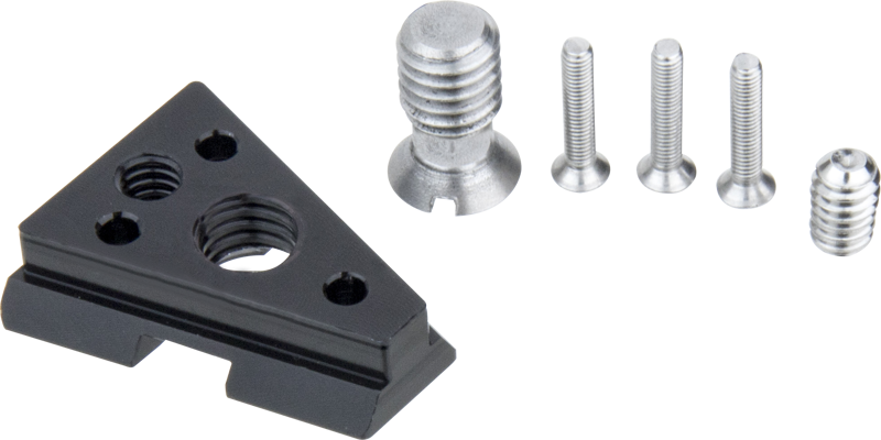 Kupo KS-270 V-Lock Wedge, a black triangular shaped metal mounting plate with spiral grooves, is shown on a light coloured background next to four silver screws.
