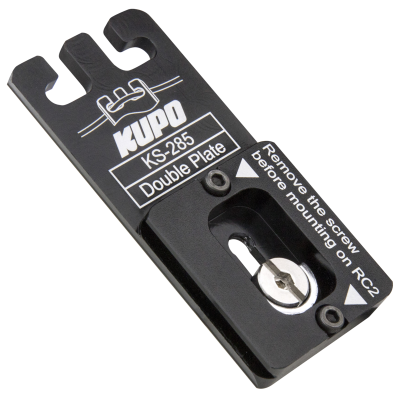 The black Kupo KS-285 Double Plate (Quick Release Plate for Arca-Swiss & RC2) has a white marking, a mounting slot and a visible screw. Instructions: remove the screw before attaching to the RC2.
