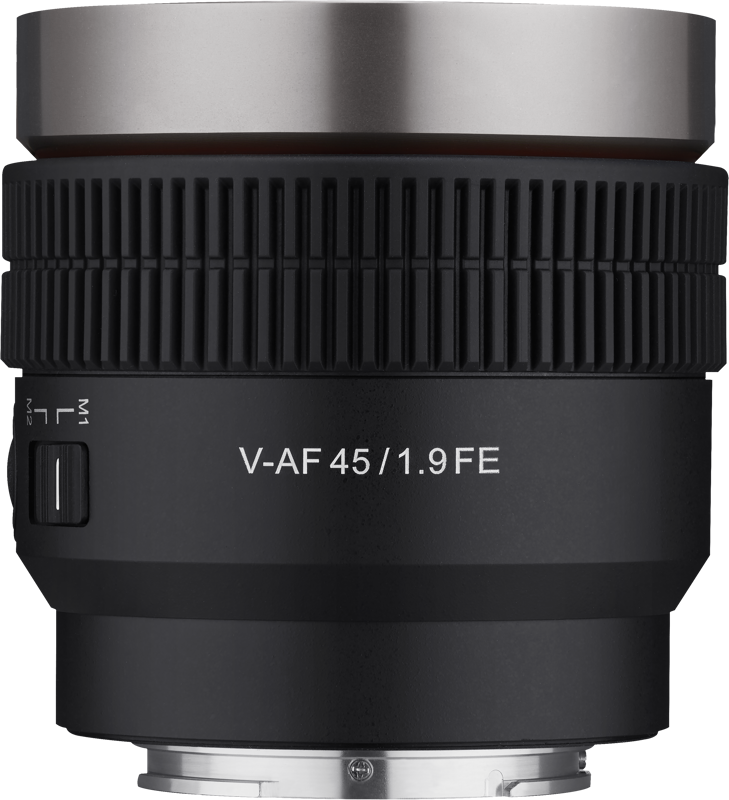 A close-up of the black Samyang V-AF 45mm T1.9 lens on the Sony FE shows the silver highlights, textured focus ring and side switch. The brand name is printed in white on the lens against a white background.