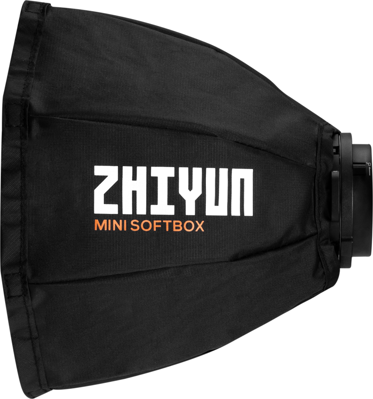 Zhiyun Mini Softbox (ZY Mount) on musta valokuvaukseen tai videokuvaukseen tarkoitettu softbox, jonka kyljessä on ZHIYUN-tuotemerkki suurilla valkoisilla kirjaimilla ja MINI SOFTBOX pienemmillä oransseilla kirjaimilla.