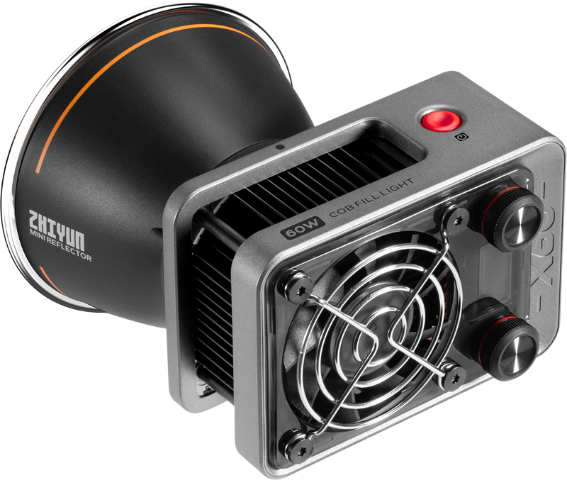 Zhiyun LED Molus X60 Cob Light -valaisimessa on musta heijastinkartio, metallinen runko, jäähdytystuuletin, säätönupit ja punainen virtapainike yläpaneelissa.