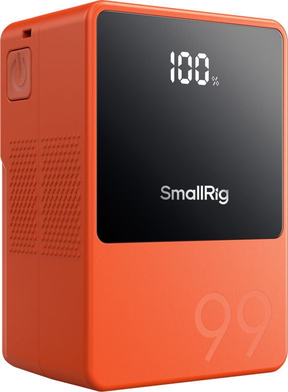 SmallRig 4929 V-Mount Battery Mini VB99 (oranssi) sisältää mustan digitaalinäytön, jossa näkyy 100 %, virtanäppäimen sivussa ja numeron 99 kohokuvioitu etupuolen alaosassa.
