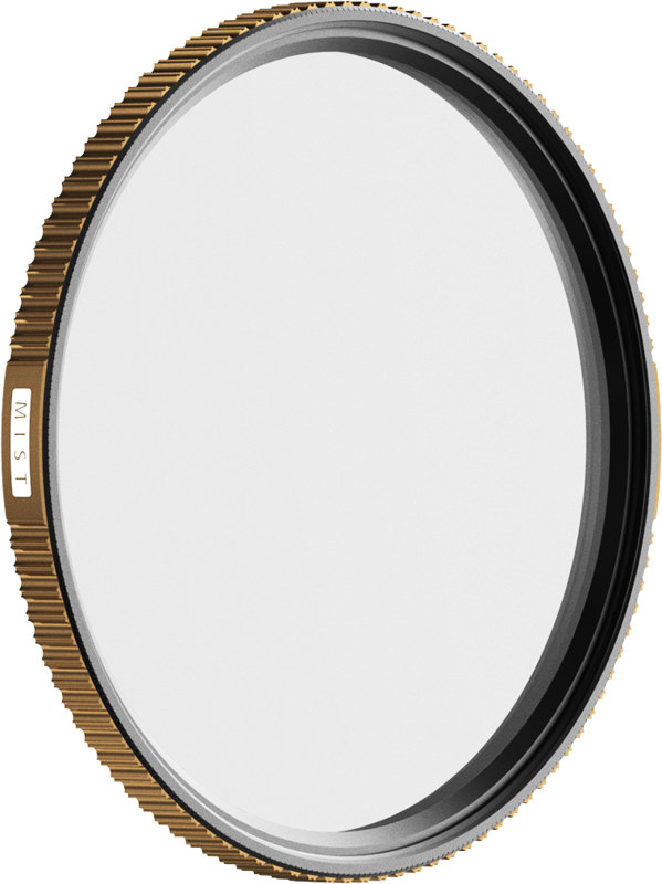 The PolarPro Quartzline Mist (1/4 diffusion) filter 67 mm has a gold brushed edge, a small "MIST" marking and transparent glass in a thin metal ring. The background is light and plain.