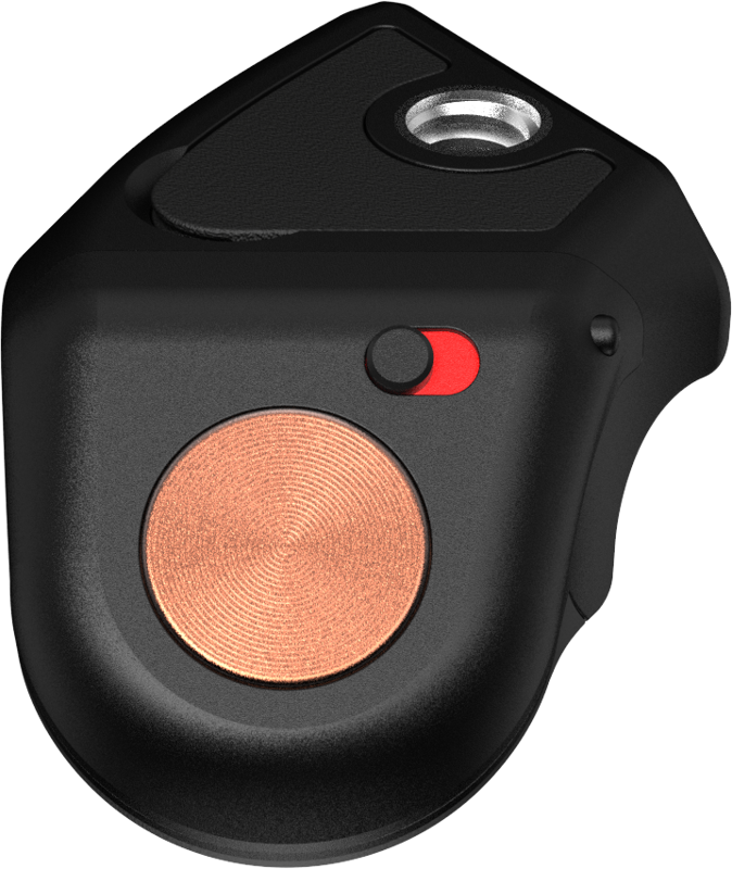 Close-up of the PolarPro Bluetooth Shutter Button Adapter, a small black device with a round copper-coloured button, a red and black switch and a metal hole on top. Its sleek and modern finish adds to its stylish design.