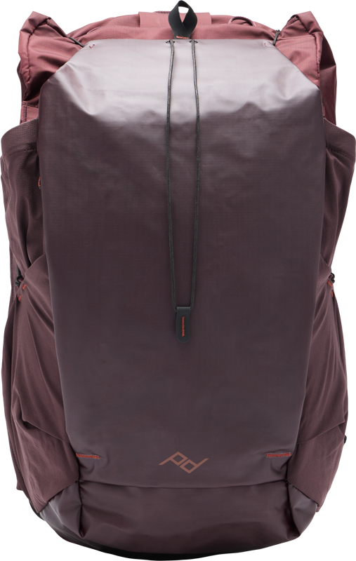 The Peak Design Outdoor Backpack 45L - Eclipse features reddish brown and dark purple colours, a stylish angular design, top handle, side pockets and a subtle front logo.