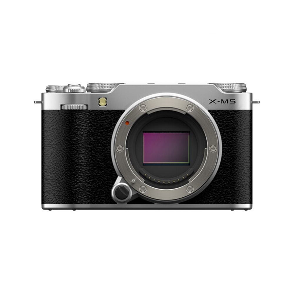 Fujifilm X-M5 system camera, silver shown with black textured grip on the front, silver top and X-M5 badge. The body of the camera shows the lens mount and image sensor.