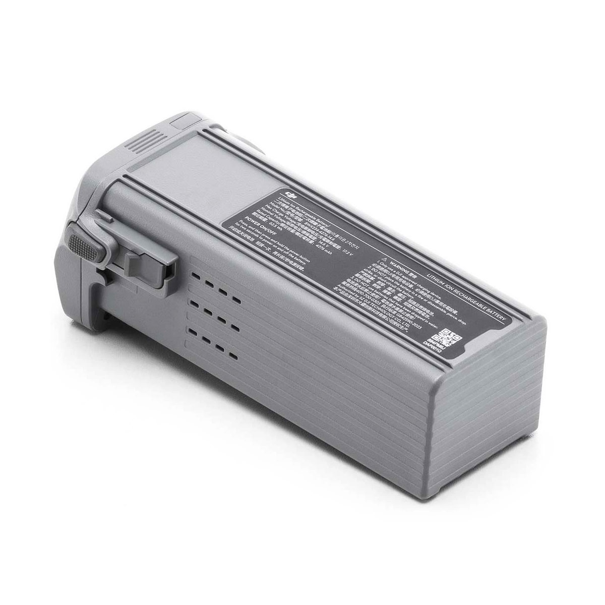 DJI Air 3S Intelligent Flight Battery -vara-akku on suorakulmainen harmaa akku, jonka toisella puolella on tekniset tiedot sisältävä etiketti ja toisessa päässä on salpamekanismi.