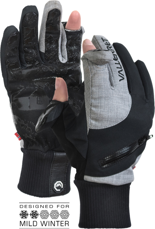 Vallerret W'S Nordic Photography Glove - XS on mustan ja harmaan sävyiset talvihanskat, joissa on kuvioidut kämmenet, vetoketjut ja paljastetut peukalon- ja etusormenpäät yhdessä hanskassa. Suunniteltu leudolle talvelle, tekstissä lumihiutalekuvakkeet.