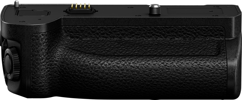 Panasonic's battery grip for the Lumix S5 II / G9 II is shown with a black surface, adjustment wheel, connection pins and tripod mount, pictured from above against a plain background.