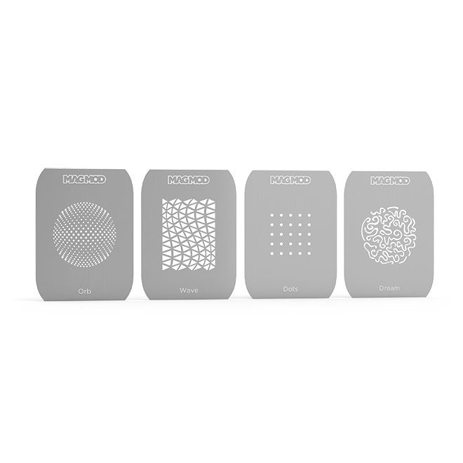 Neljä suorakaiteen muotoista harmaata MagMod MagMask Pattern 1 -kaavioita - Orb, Wave, Dots ja Dream - joissa jokaisessa on selkeä geometrinen tai abstrakti leikkauskuvio - ovat vierekkäin valkoisella pohjalla.
