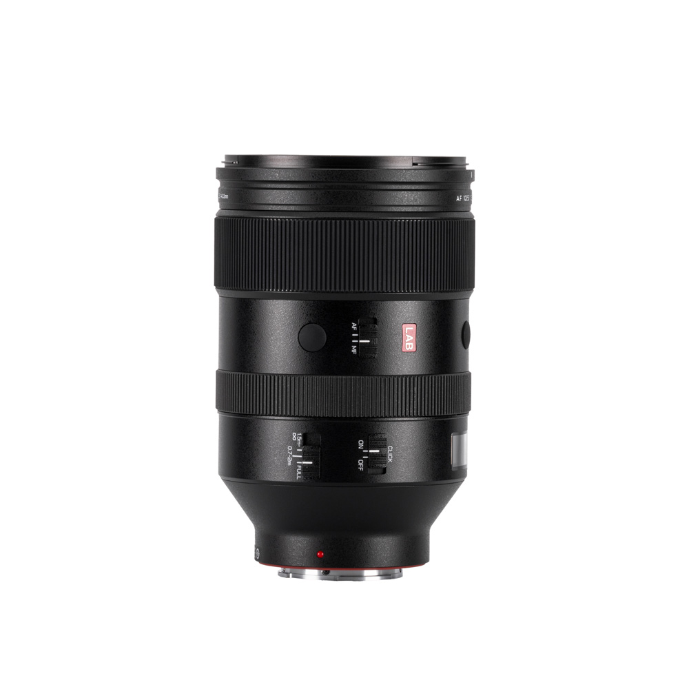 The Viltrox AF 135mm f/1.8 LAB lens for Sony E is a black lens with multiple switches and dials, standing upright against a white background, with a red square "S" and a silver metal mount at the bottom.