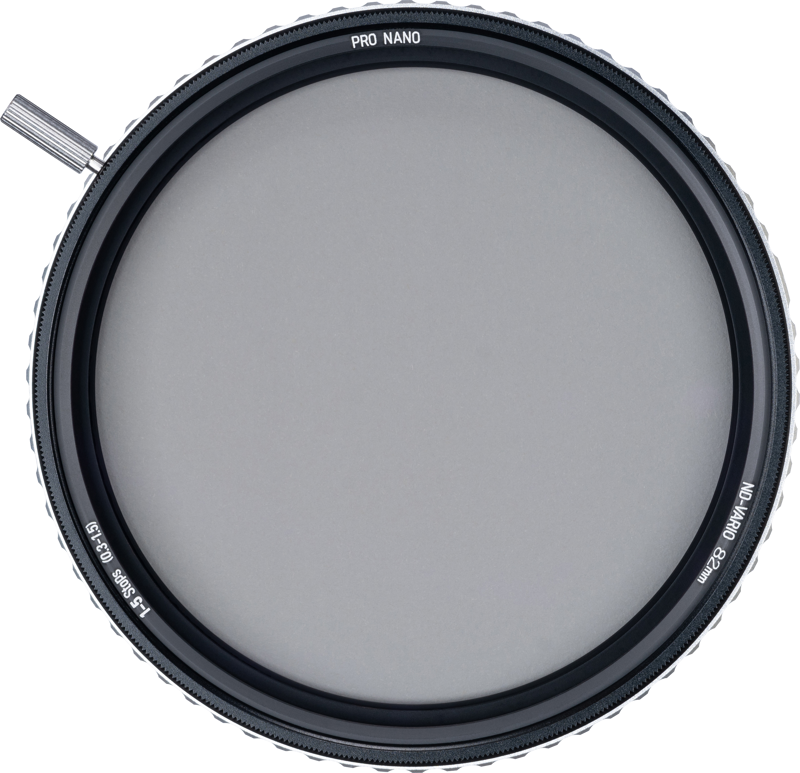 The NiSi TRUE COLOR ND-VARIO 1-5 Stop 86mm adjustable grey filter is a round lens filter with a textured edge and a small adjustment lever, viewed from above against a light background.